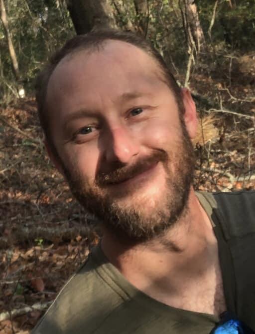 Nicholas Sammartino walking peacefully through wooded trails in Georgia.