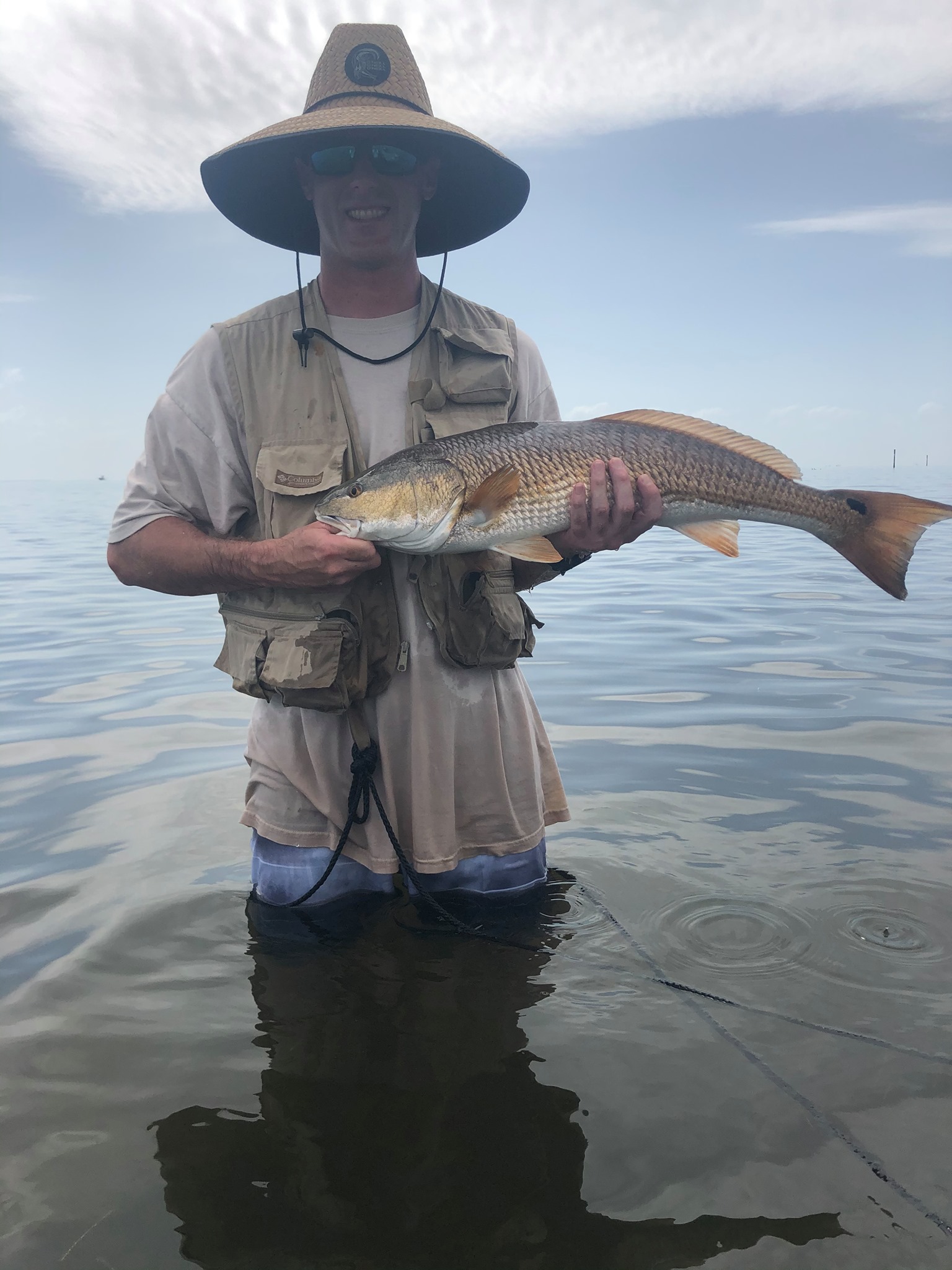 Nicholas Sammartino holding a redfish while fishing in Chatham County