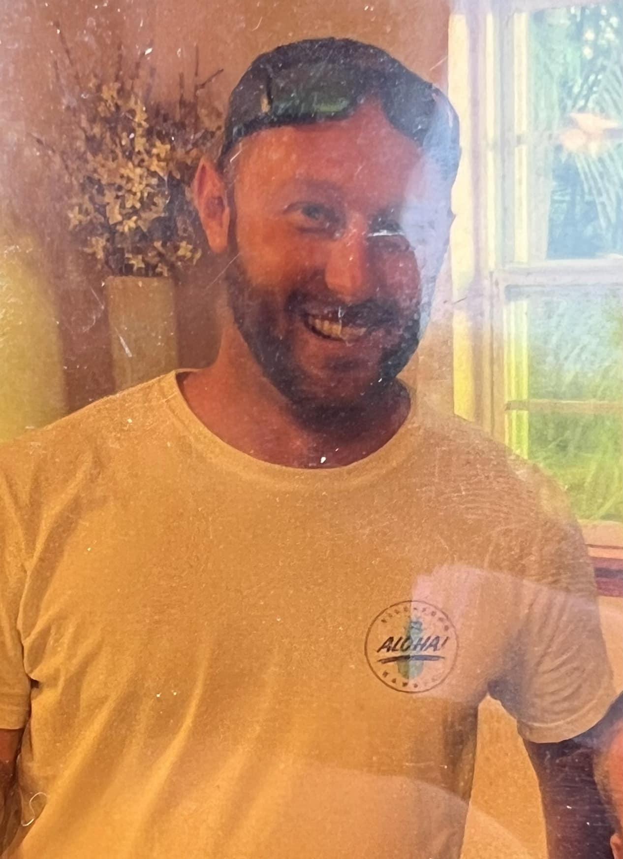Nicholas Sammartino smiling outside his home in Chatham County, Georgia.